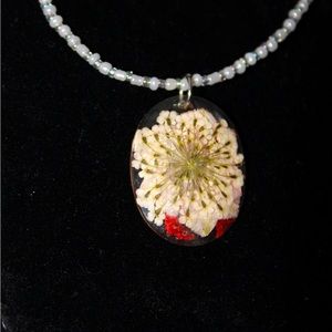 White and clear seed bead necklace with a resin pendant